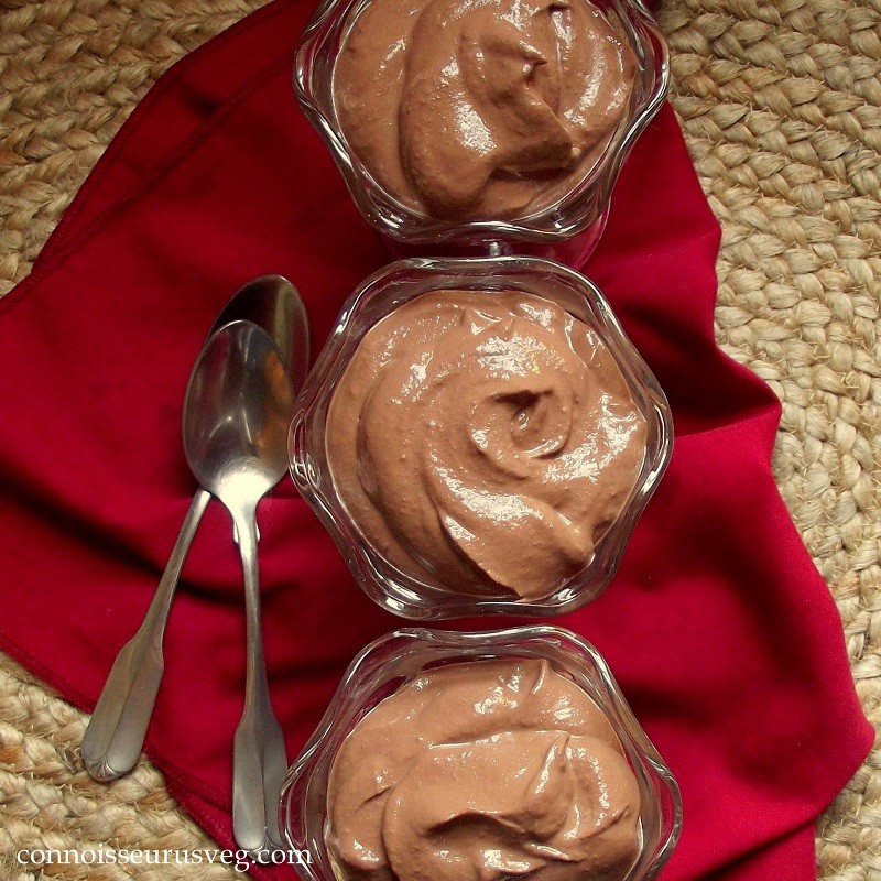Three Dishes on Vegan Chocolate Mousse with Red Napkin and Spoons
