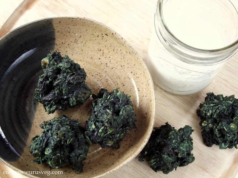Overhead View of a Dish of Spirulina Cookies and Glass of Milk