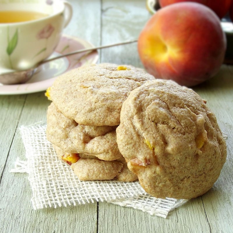 Stack of Scones with Peaches and Cup of Tea in the Background