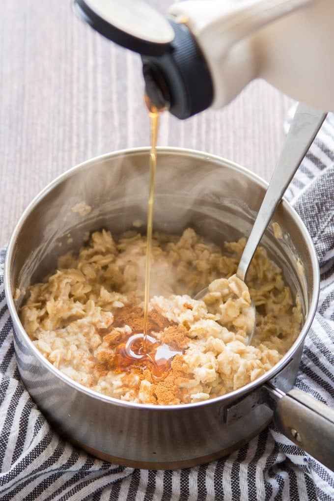 Maple Syrup Pouring into a Pot of Oatmeal