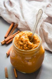 Jar of Pumpkin Butter with a Spoon Sticking Out