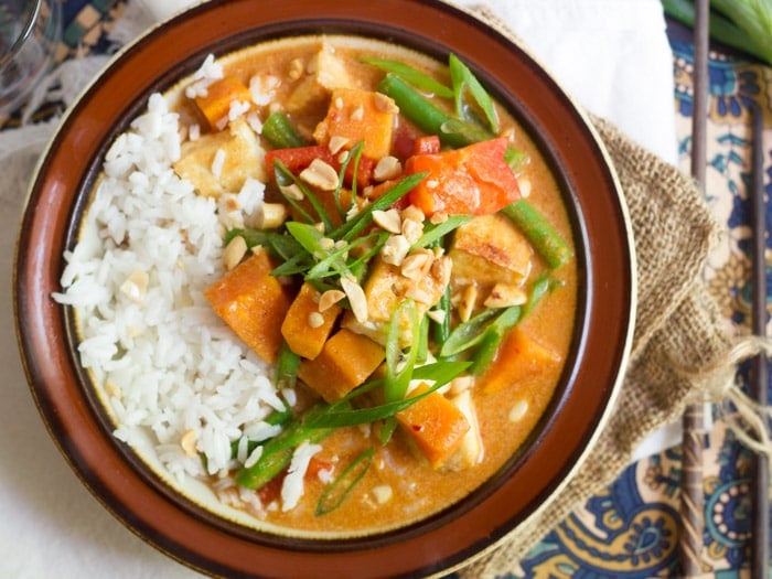 Bowl of Massaman Curry with Rice, Peanuts and Scallions