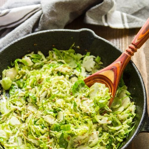 Dijon Brussels Sprouts in a Skillet with Wooden Spoon