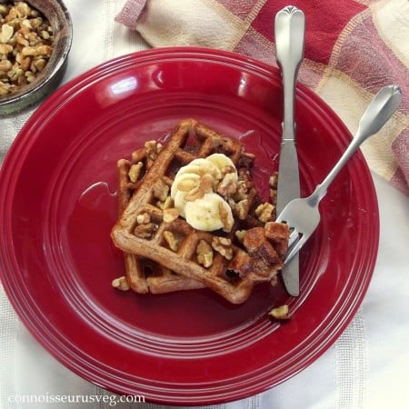Overhead View of Banana Waffles on a Plate with Fork and Knife