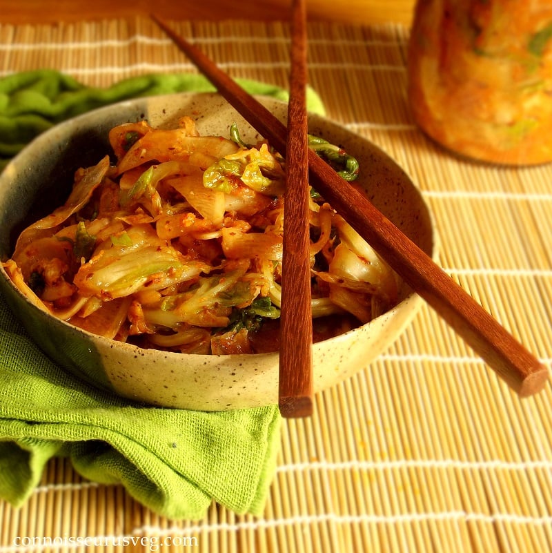 Bowl of Kimchi with Chopsticks, Jar of Kimchi in the Background