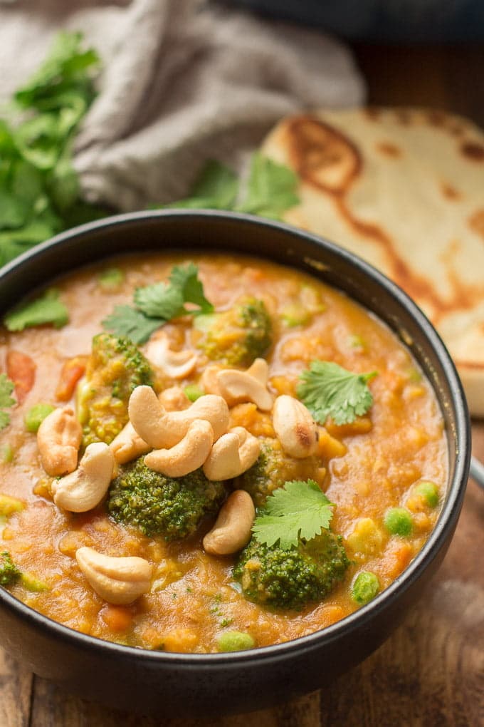 Close Up of Mulligatawny Soup Topped with Cashews and Cilantro