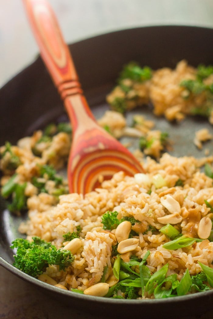 Kale & Peanut Butter Fried Rice in a Skillet with Wooden Spoon