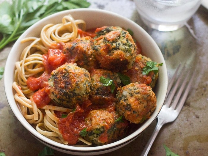 Cannellini Bean & Broccoli Rabe Meatballs and Pasta in a Bowl with Fork on the Side