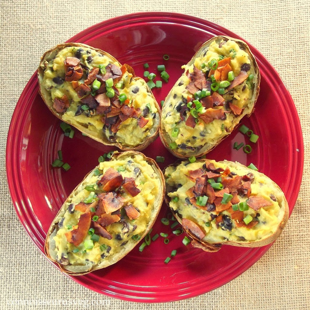 Overhead View of Four Vegan Twice Baked Potato Halves on a Red Plate