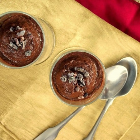 Overhead View of Two Glasses of Avocado Chocolate Mousse with Spoons on the Side
