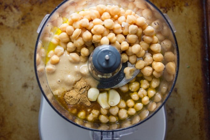 Chickpeas, Tahini, Garlic and Spices in a Food Processor Bowl