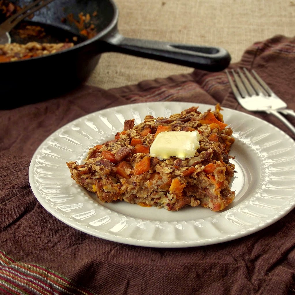 Slice of Sweet Potato Baked Oatmeal on a Plate with Fork, Skillet in the Background