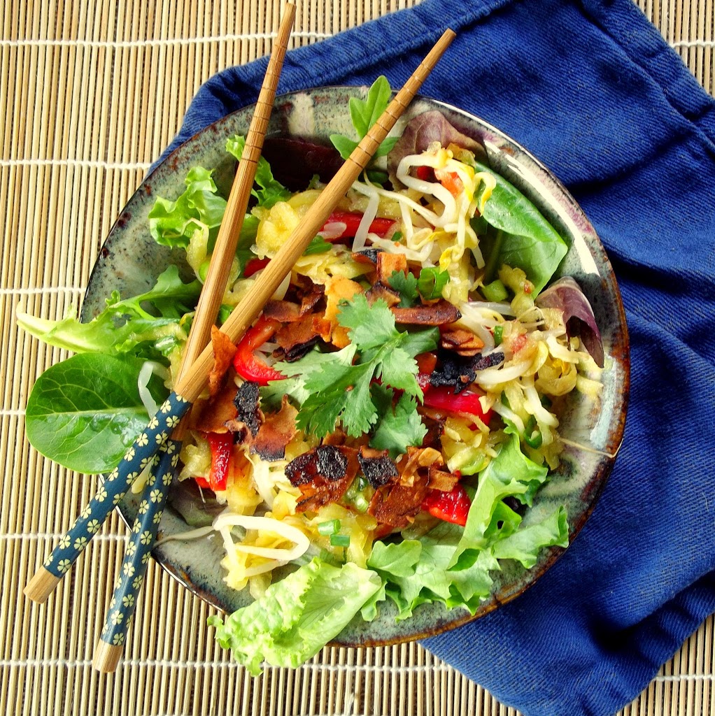 Overhead View of a Bowl of Mango Salad with Chopsticks on Top