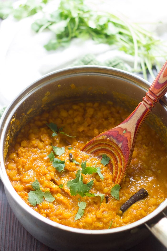 Yellow Split Pea Dal in a Pot with Wooden Spoon