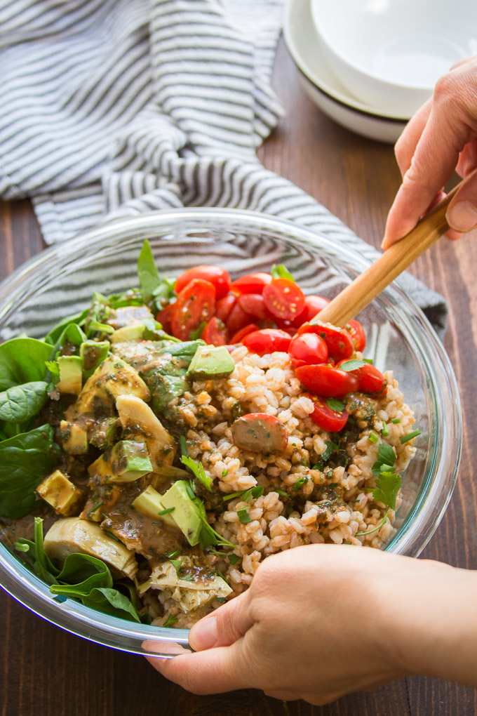 Hand Stirring Farro Salad Together in a Bowl
