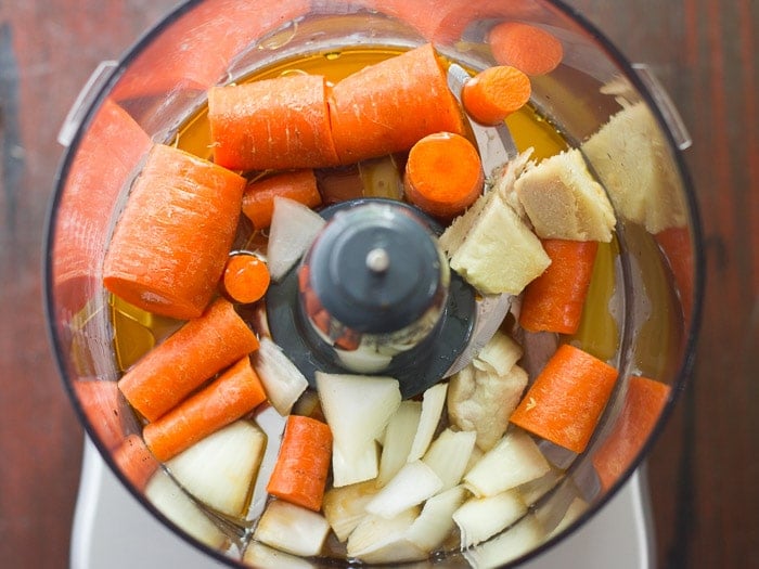 Ingredients for Making Carrot Ginger Dressing in a Food Processor Bowl