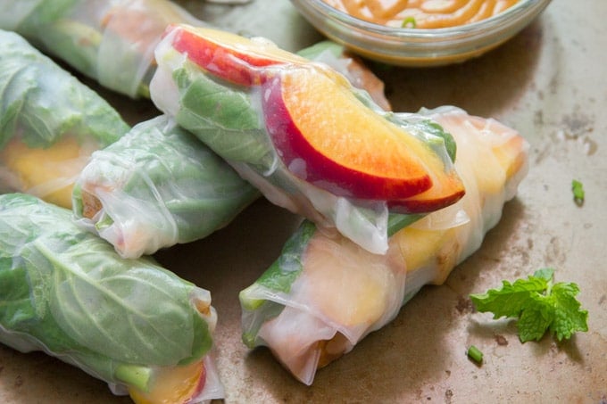 Close up of a Stack of Tofu & Peach Summer Rolls with Peanut Dipping Sauce