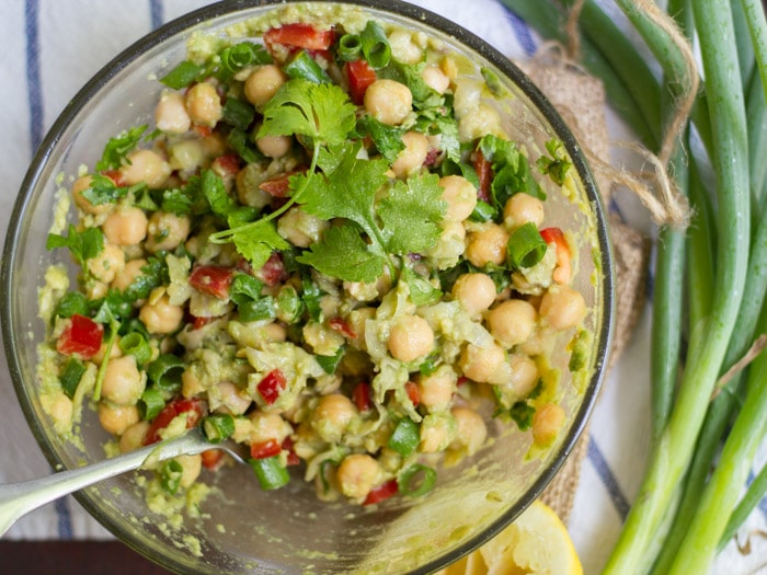 A Bowl of Smashed Chickpea Salad with Spoon