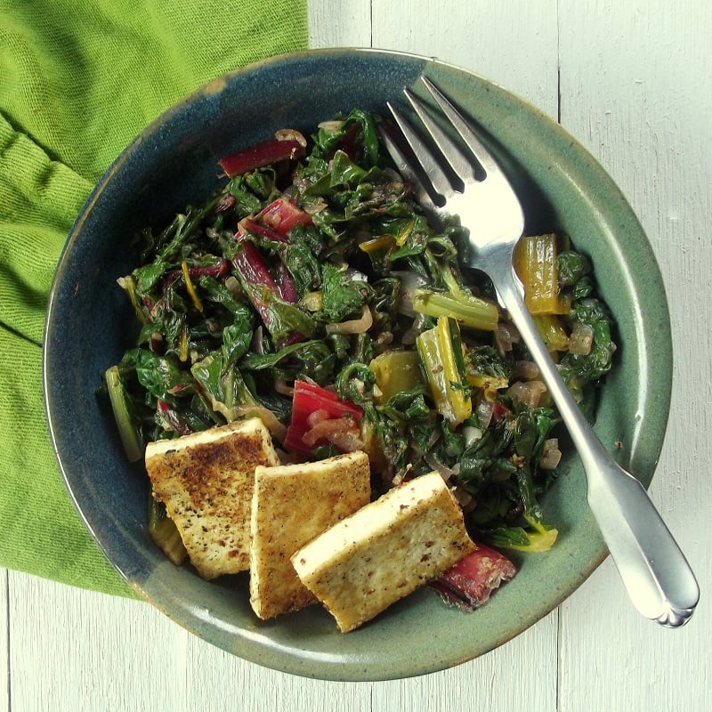 Overhead View of a Bowl of Chard and Tofu with Fork