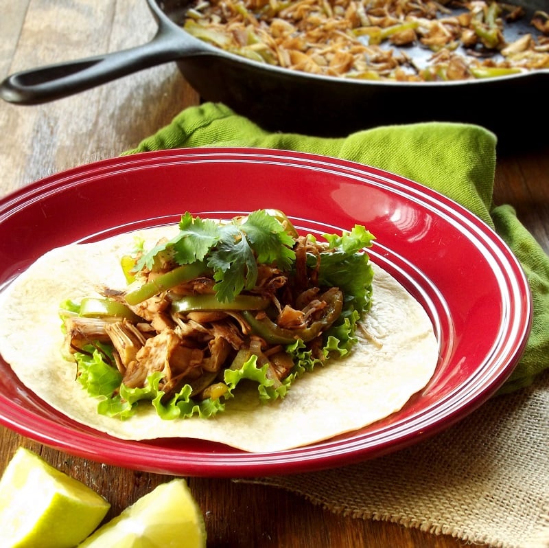 Jackfruit Fajita on a Plate with Skillet in the Background