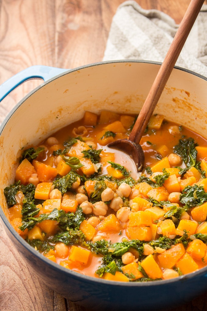 Butternut Squash Curry in a Pot with Wooden Spoon