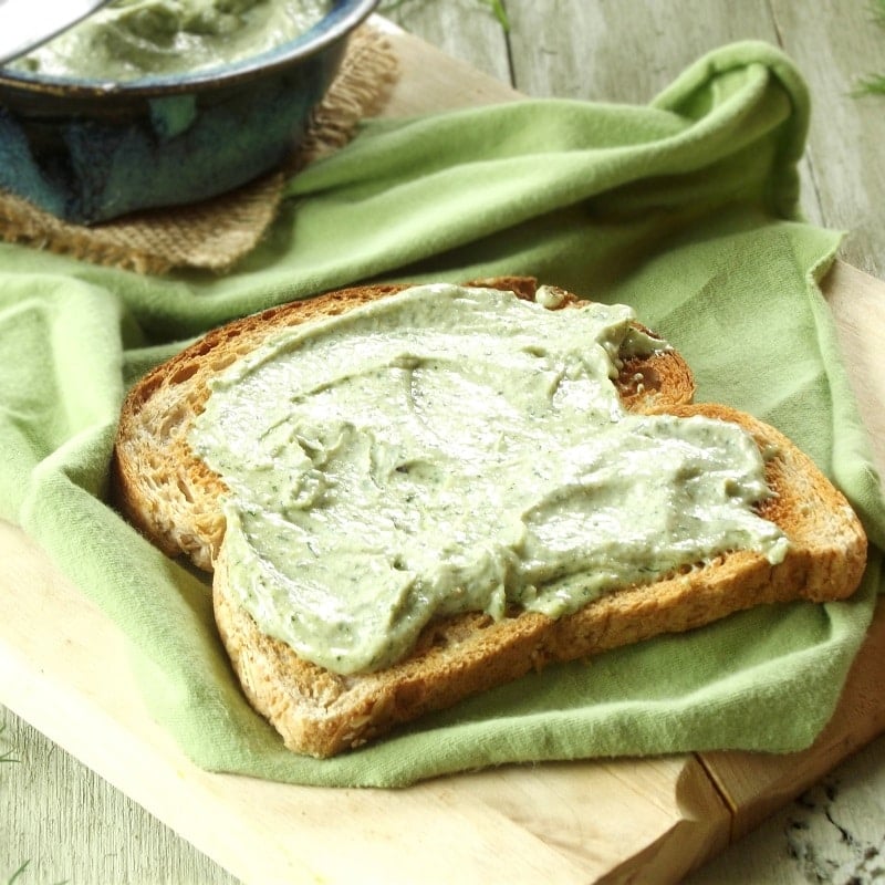 Slice of Toast Covered in Hemp Cheese on a Green Cloth