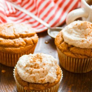 Vegan Pumpkin Muffins with Cashew Cream Cheese Frosting with a Striped Napkin