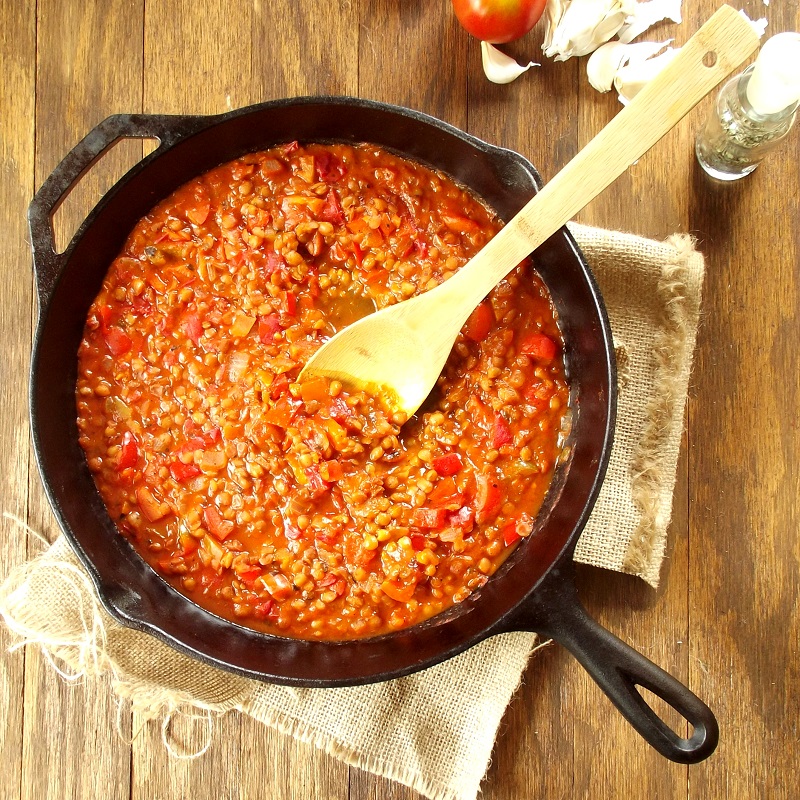 Lentil Bolognese in a Skillet with Wooden Spoon