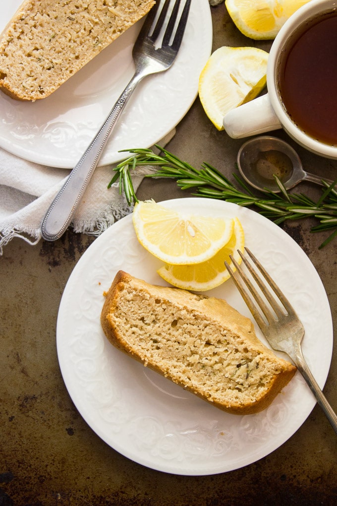Overhead View of Two Slices of Rosemary Lemon Vegan Pound Cake on Plates with Coffee Cup