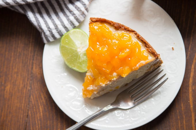 Overhead View of a Slice of Vegan Cheesecake with Mango Lime Topping on a Plate