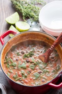 Caribbean Bean Soup with Collard Greens in a Pot with Serving Spoon