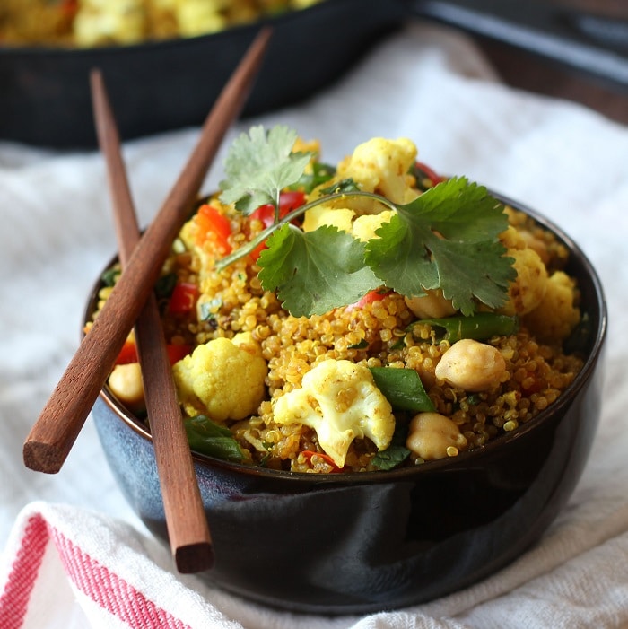 Bowl of Curried Quinoa Fried Rice with Chopsticks, Skillet in the Background