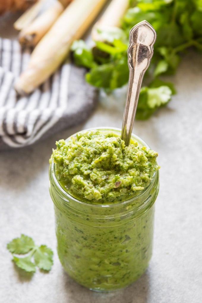 Jar Filled with Vegan Green Curry Paste with Spoon