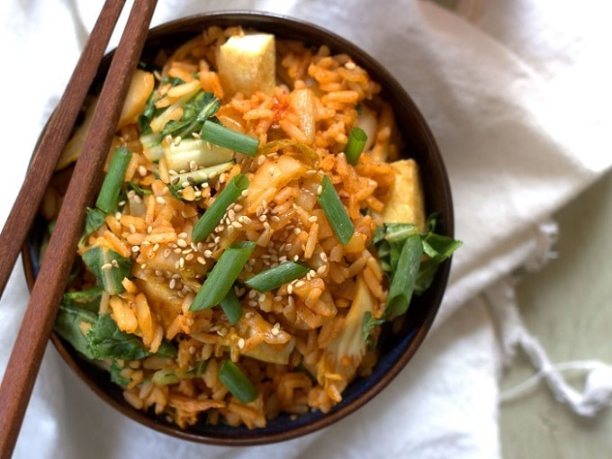Top View of a Bowl of Kimchi Fried Rice with Chopsticks