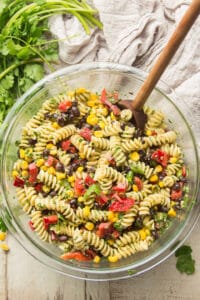 Bowl of Southwest Pasta Salad on a White Wooden Surface