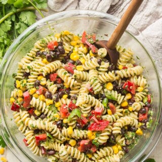 Bowl of Southwest Pasta Salad on a White Wooden Surface