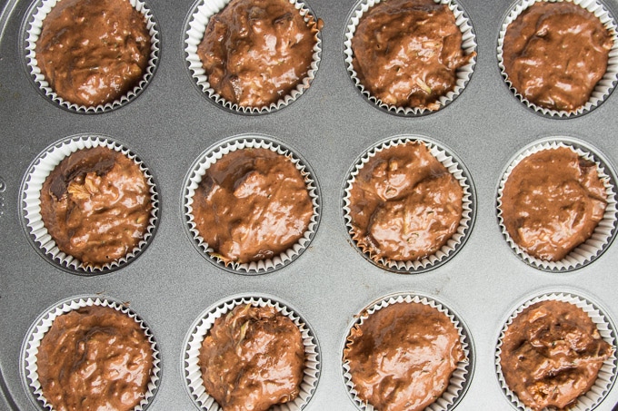 Muffin Tin Filled with Vegan Chocolate Zucchini Muffin Batter