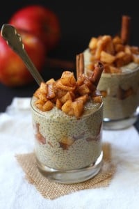 Two Peanut Butter Apple Chia Parfaits with an Apple in the Background