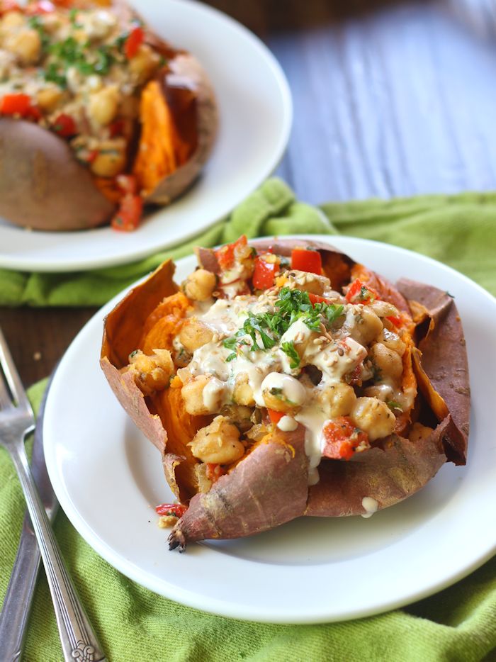 Chickpea Stuffed Sweet Potato on a Plate with Fork on the Side