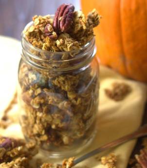 Jar of Pumpkin Granola with a Pumpkin in the Background