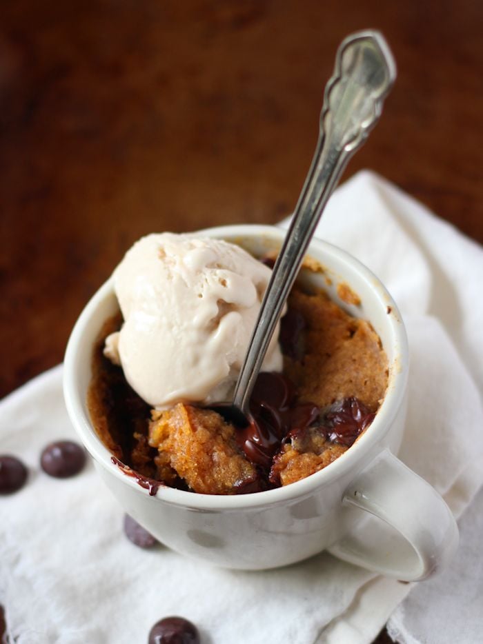 Pumpkin Mug Cake and Scoop of Vanilla Ice Cream in a Tea Cup with Spoon