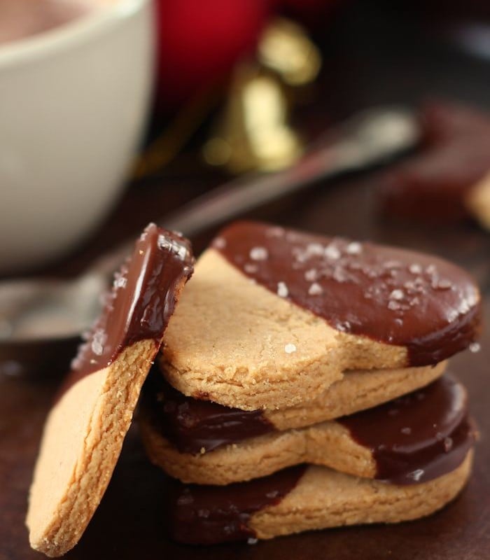 Stack of Peanut Butter Maca Shortbread Cookies with Coffee Cup and Spoon in the Background