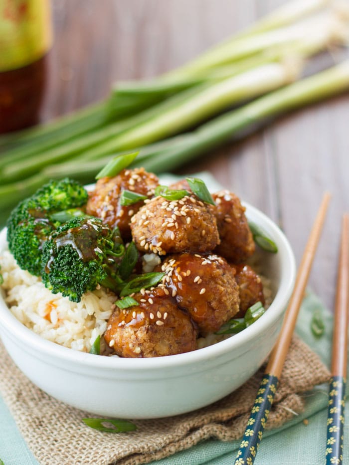 Bowl of Tofu Meatballs, Rice and Broccoli with Chopsticks on the Side
