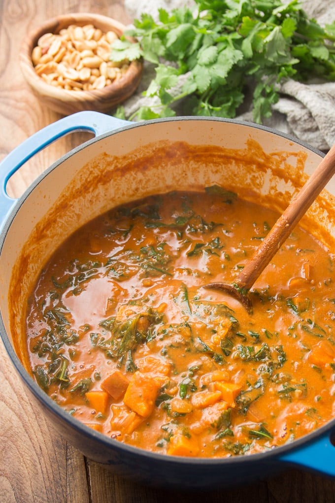 Pot of African Peanut Soup with Wooden Spoon