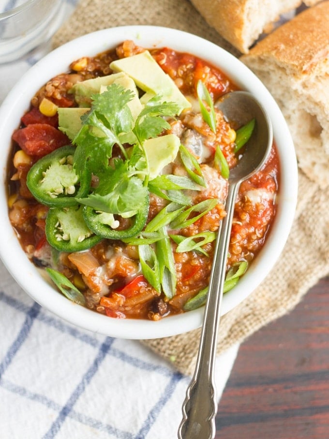 Overhead View of a Bowl of One-Pot Quinoa Chili Topped with Avocado and Jalapeno Slices