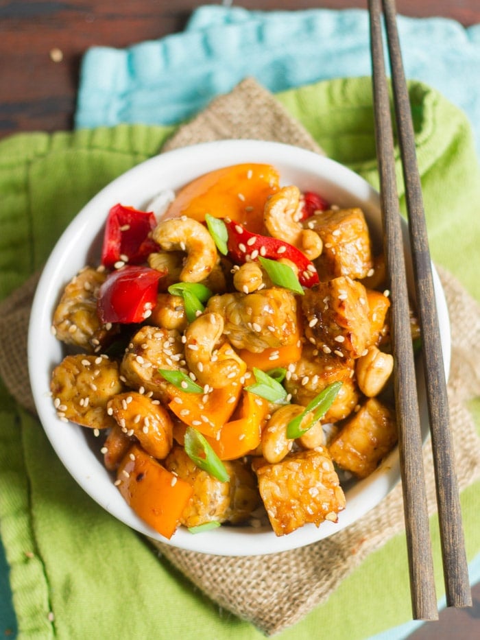 Bowl of Tempeh Stir-Fry with Chopsticks Perched on Top