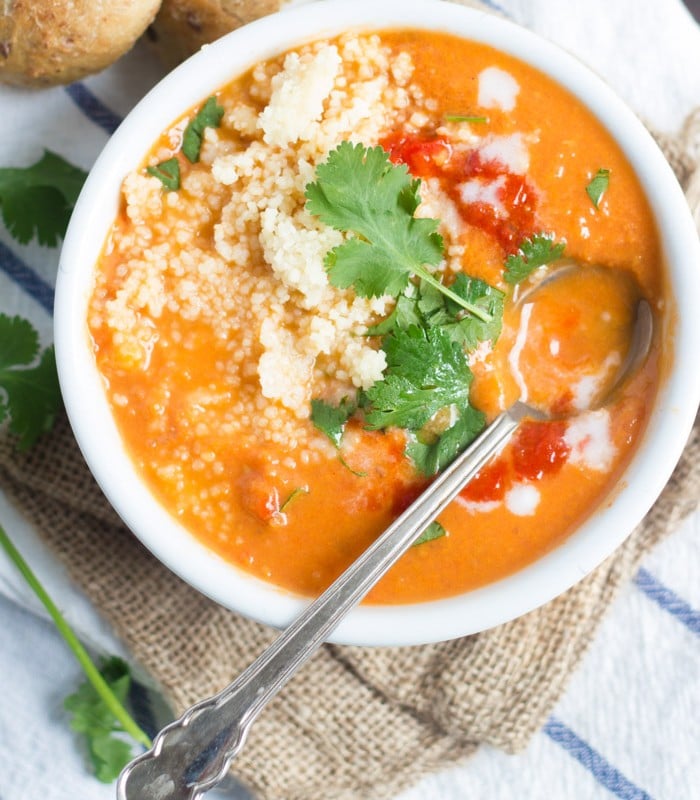 Overhead View of a Bowl of Roasted Tomato Soup and Couscous Topped with Fresh Cilantro
