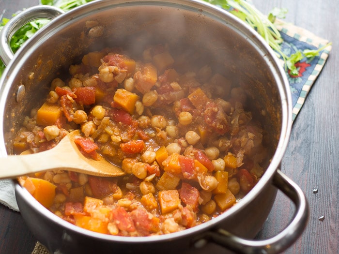 Pot of Butternut Squash Chana Masala with Wooden Spoon