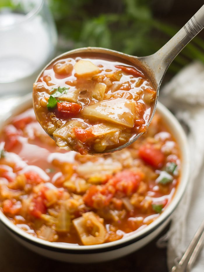 Close Up of a Ladle Filled with Vegan Cabbage Roll Soup