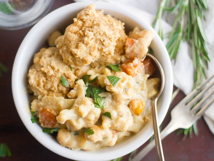 Close Up of Creamy Cauliflower Savory Vegan Cobbler in a Bowl with Fork and Spoon